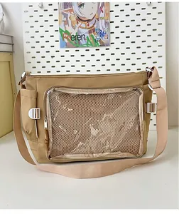 Detail of khaki ita bag with large transparent window and honeycomb mesh insert