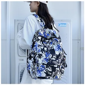 Close-up of graffiti backpack with astronaut pendant on a side-rear model view