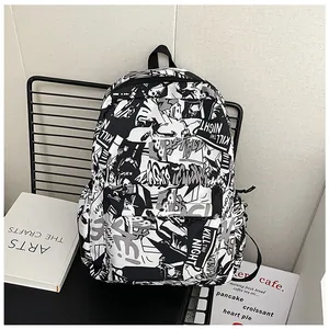 Detail of canvas backpack with black and white graffiti print and side pocket storage