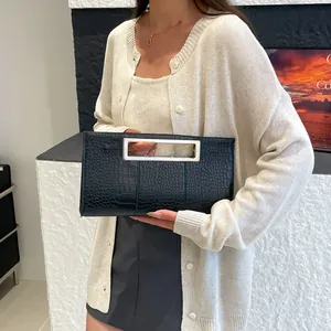 Chic black crocodile embossed clutch bag with sleek silver metal handles for women