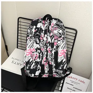 Detail of street graffiti print school backpack on chair featuring 'KILL THE NIGHT' text