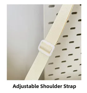 Detail of adjustable woven shoulder strap with white buckle for students bag