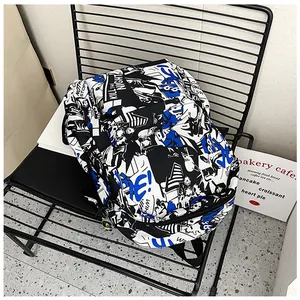 Detail view of the durable nylon school backpack featuring comic-style graffiti print