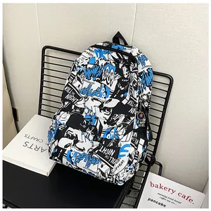 Close-up of graffiti backpack with Kill The Night print and astronaut pendant charm