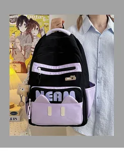 Detail of color-block backpack with NEAM letters, cat ear decor, and plush bear charm