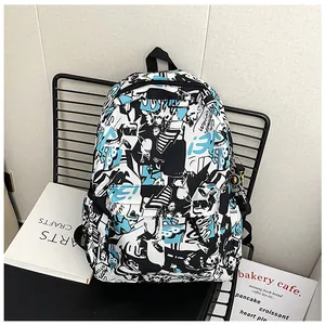 Detail of trendy graffiti backpack with stylish astronaut keychain on metal chair