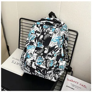 Close-up of graffiti print backpack on a metal chair with astronaut charm detail