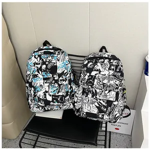 Detail of canvas backpacks featuring black, white and blue comic graffiti prints and lettering