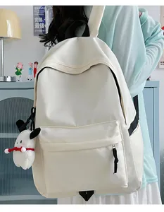 Close-up of minimalist cream white nylon backpack with waterproof texture and side buckle