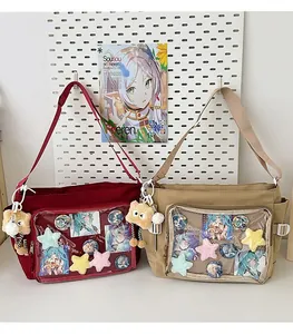 Detail view of large transparent PVC compartment on canvas ita bags for badge display