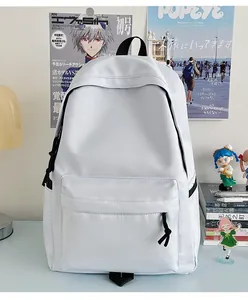 Minimalist white nylon student backpack with large zipper pocket on a creative desk