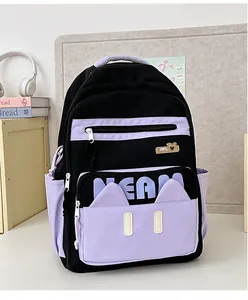 Detail of black and purple school backpack with multiple compartments and side pockets