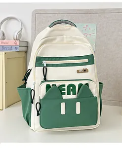 Close-up of contrast laptop backpack featuring cat ear pocket and TEAM letter detail