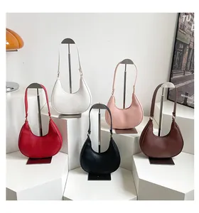 Detailed view of crescent shoulder bags in five colors with lychee grain leather texture