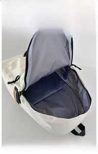 Detailed interior view of a large capacity cream nylon backpack with grey lining