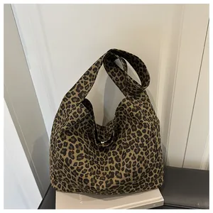 Detail of soft leopard print canvas tote bag with large capacity hobo design