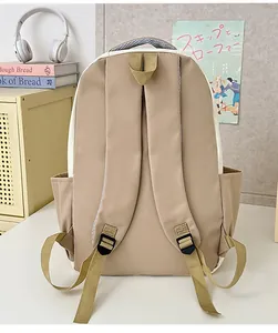 Ergonomic shoulder straps and side pockets on the khaki minimalist laptop backpack