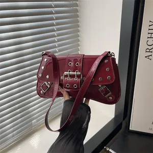 Punk style wine red patent leather shoulder bag with silver studs and metal buckles