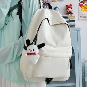 Minimalist cream white nylon backpack for students featuring a cute rabbit plush pendant