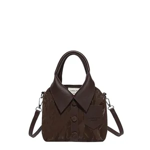 Minimalist dark brown shirt-style handbag with lapel design and leather texture