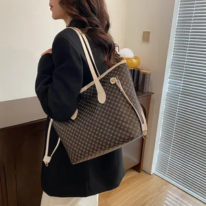 Classic large brown tote bag with geometric patterns and beige leather straps for work