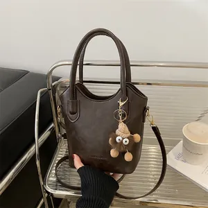 Women PU Leather Bucket Bag Large Capacity Retro Shoulder Crossbody Bag With Monster Plush Pendant Fashion Commuter Tote Handbag