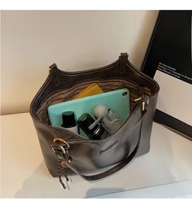 Top view showing the large capacity and striped lining of this brown leather tote bag