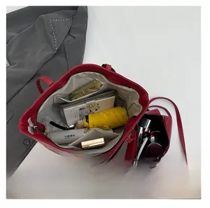 Interior layout of red tote bag set showing large capacity for umbrella and notebook