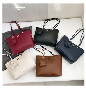 Detail of multi-color tote bag set with matching pouches in five sophisticated shades