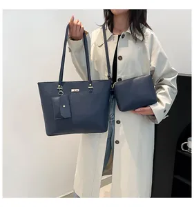 Navy blue faux leather tote bag three-piece set showing large bag and inner pouch