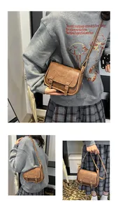 Three-way view of a brown vintage PU saddle bag showing crossbody and handheld styles