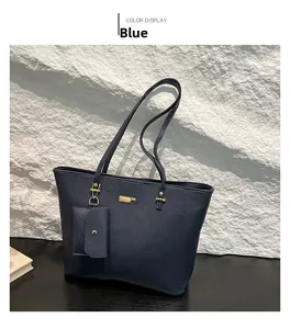Detail of blue pebble leather tote bag with gold hardware and matching coin pouch