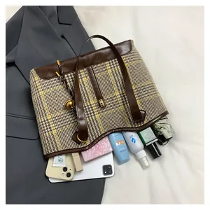 Detailed top view of large plaid tote bag showing ample space for daily essentials