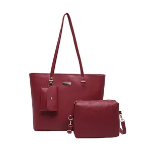 Three-piece burgundy faux leather tote bag set with lychee texture and gold accents