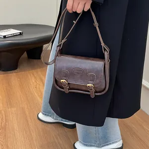 Retro dark brown PU leather saddle crossbody bag with dual straps and fashion stamp
