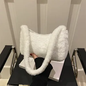 White faux fur shoulder bag with soft plush texture for elegant early spring fashion
