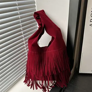 Retro burgundy faux suede tote bag with long tassels and minimalist shoulder strap design
