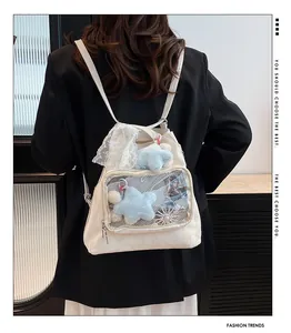 White ita bag with clear display window showing plush toys and decorative cards