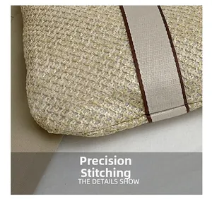 Precise stitching detail on the bottom of this minimalist woven straw shoulder beach bag