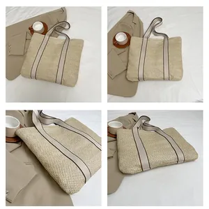 Close-up of woven straw tote bag texture and reinforced handles for beach travel