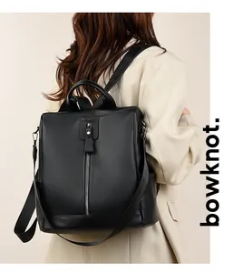 Rear view of black lychee leather backpack showing stylish urban commuting look