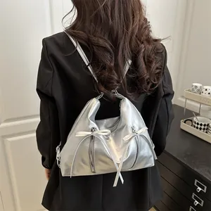 Silver metallic PU leather backpack for women with bow details and stylish versatile design