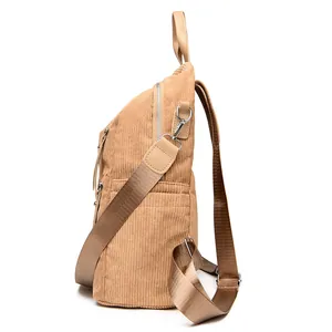 Minimalist beige corduroy backpack for women with adjustable straps in a side view profile