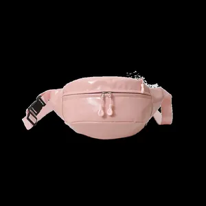Detailed view of pink sports waist bag with dual zippers and adjustable strap buckle