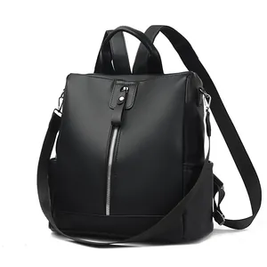 Minimalist black lychee pattern leather backpack with silver zippers and side pockets