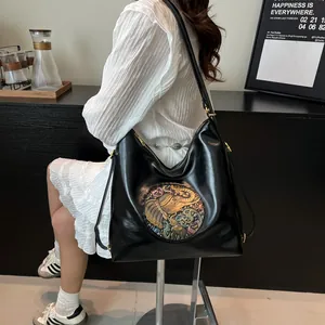 Vintage black tote bag with colorful embossed elephant pattern and large capacity