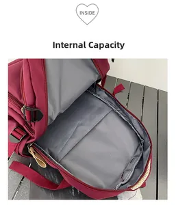 Macro view of burgundy backpack interior with gray lining and spacious storage