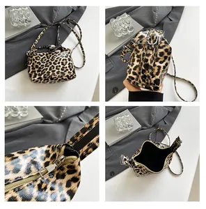 Detailed four-way view of leopard print tote bag with glossy finish and silver hardware