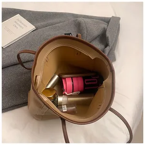 Interior view of large capacity beige tote bag showing spacious storage for essentials