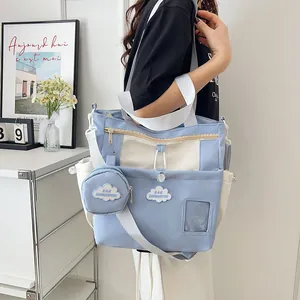 Minimalist light blue and beige canvas bucket tote bag with front transparent window pocket